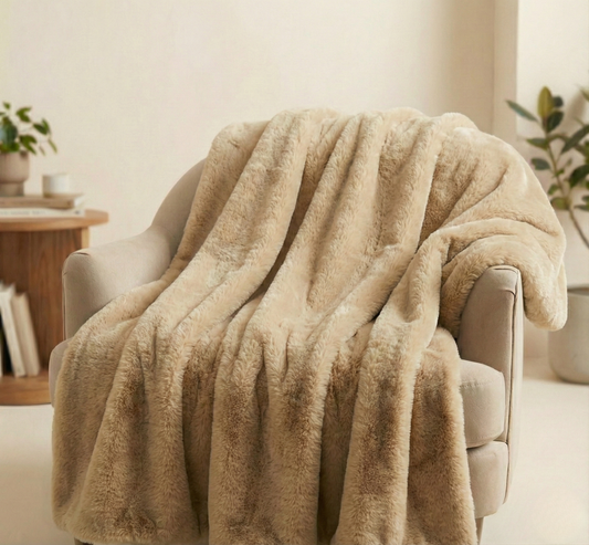 Folded green textured blanket on a light gray background. Oat Cloud Luna's Blanket, luxury throw blanket, soft and fuzzy oat cloud blanket